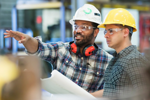 Manufacturing professionals discussing plans