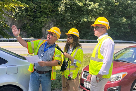 Central Hudson vegetation management experts with reporter