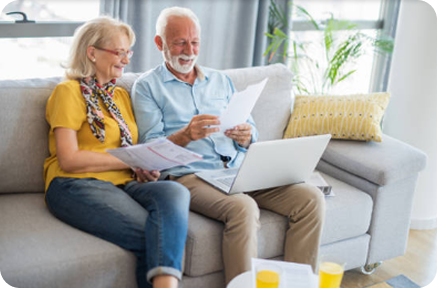 couple on couch with laptop