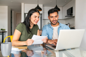 Couple looking at laptop