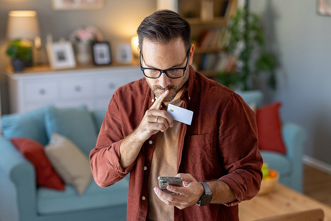 Man contemplating a potential scam call.