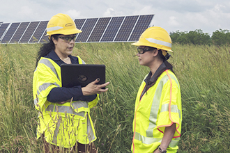 Central Hudson employees at a large solar energy installation