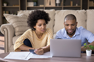 Couple at home reviewing bills