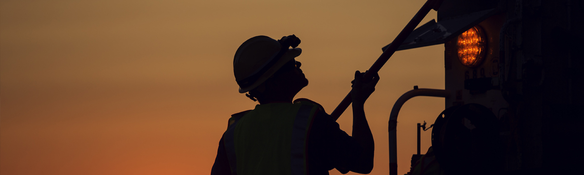 Central Hudson worker at dusk.