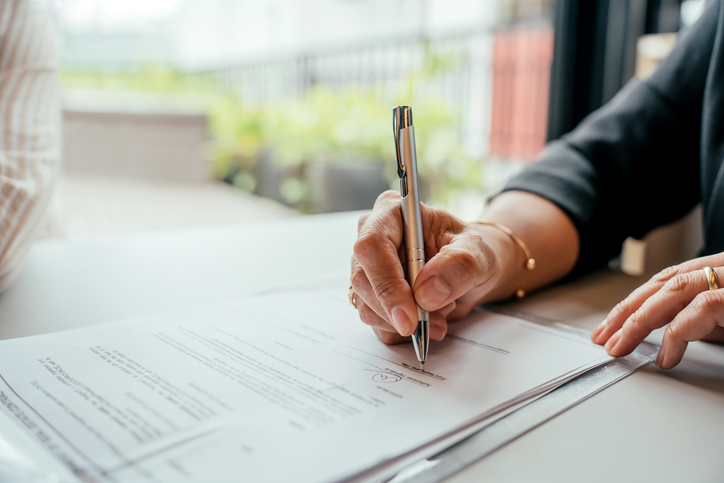 Person filling out a form