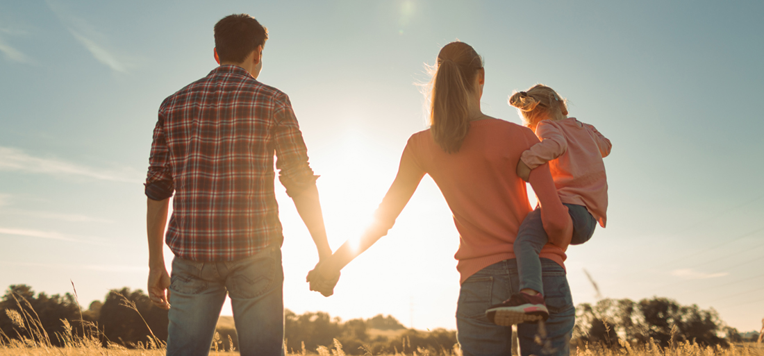 Family watching sunset