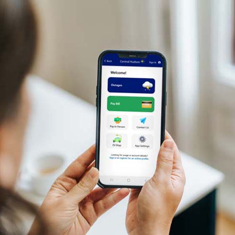 Woman using the Central Hudson mobile app