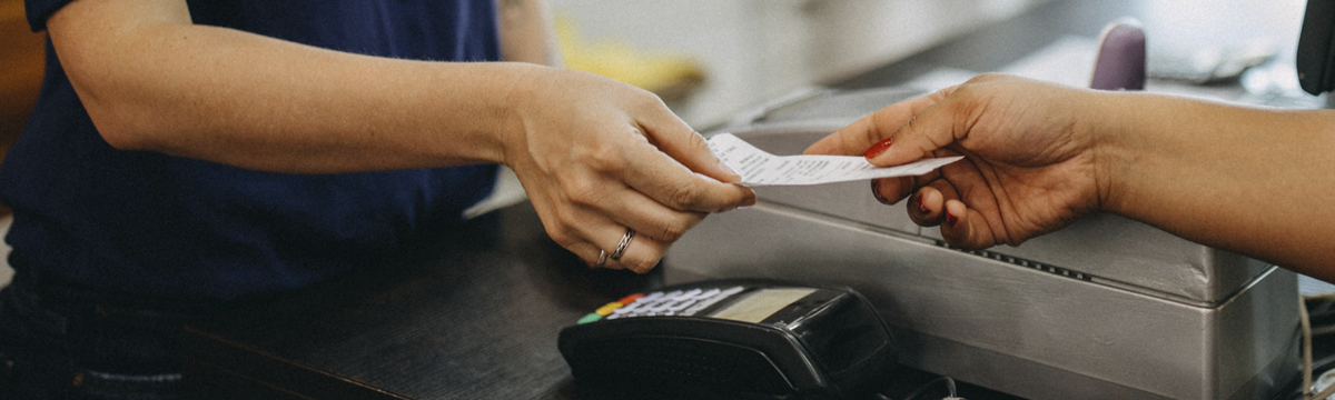 Woman paying a cashier