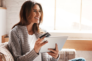 Smiling woman making payments online