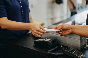 Woman paying a cashier