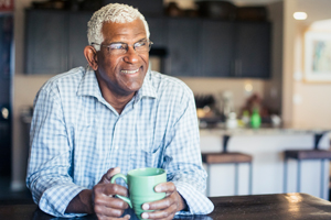 Man smiling at home in his kitchen