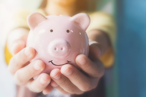 Woman holding piggy bank