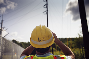 A Central Hudson employee surveys the electrical system